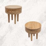freepik__mesa-auxiliar-redonda-de-madera-clara-junto-a-sof-__70026